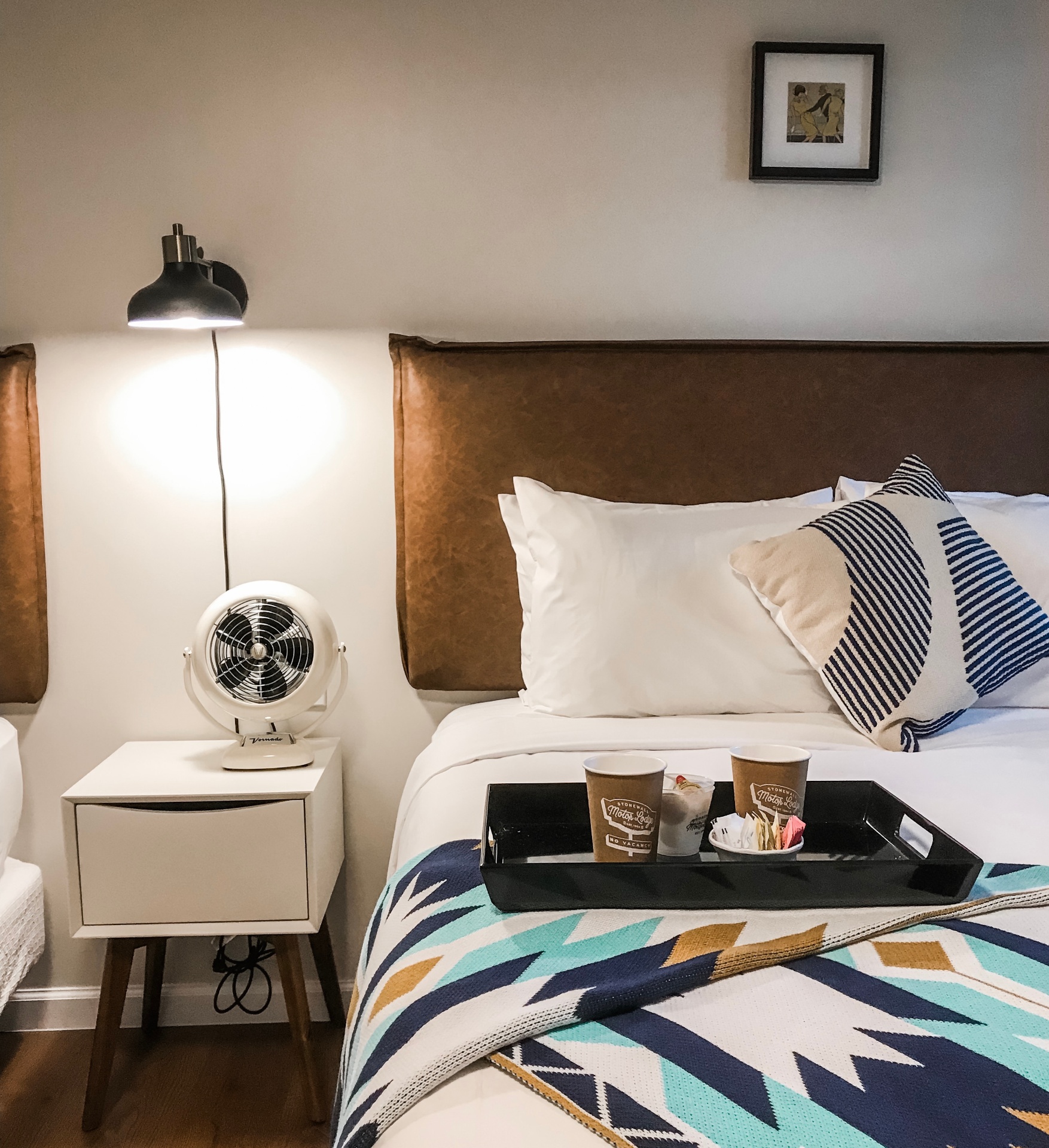 Bedside with vintage fan and Motor Lodge coffee service