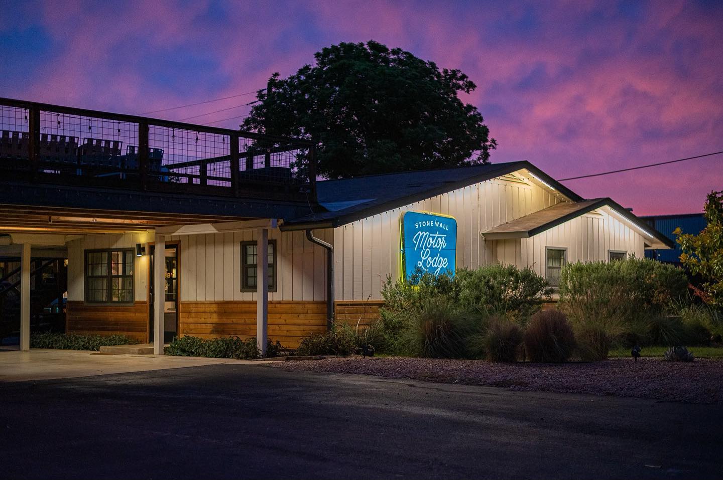 Stonewall Motor Lodge under a pink Hill Country sky