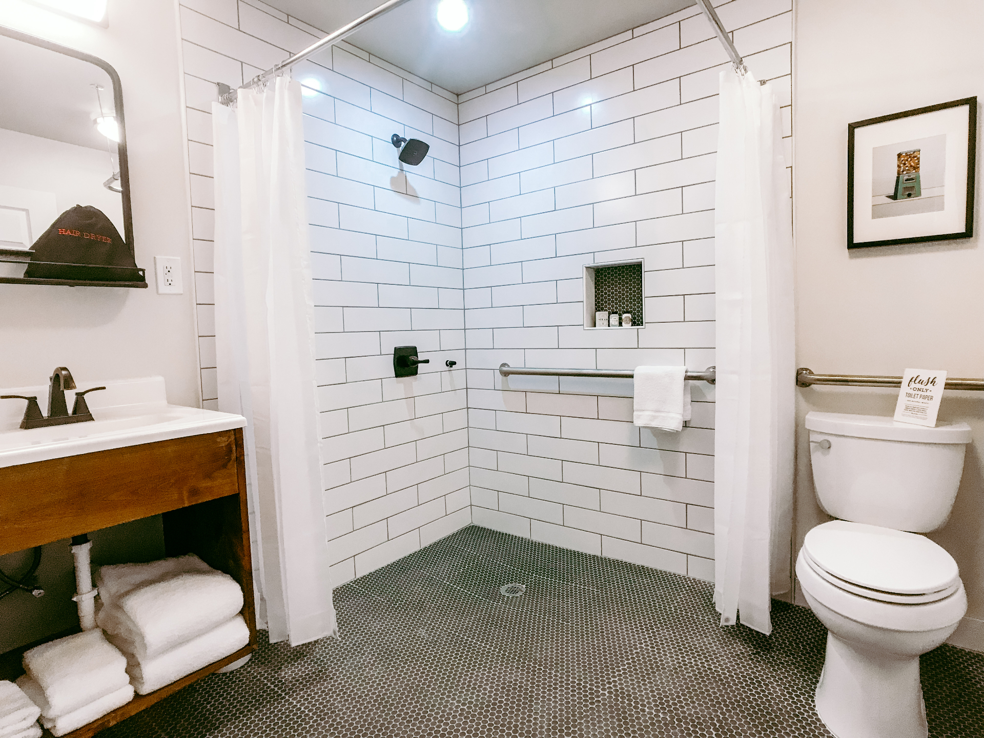 Guest bathroom with subway tile and penny floor